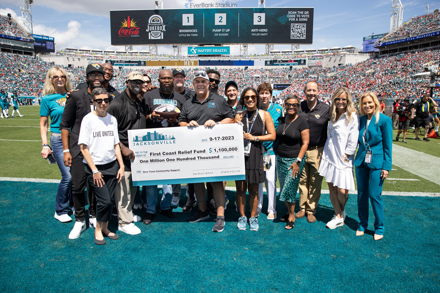 A check donation of $1.1 million was presented to the First Coast Relief Fund to help the New Town community, following the recent shooting that took place, on the field during the home opener on Sept. 17.